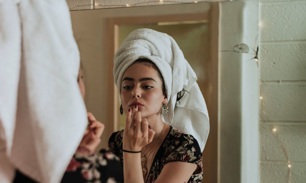 A girl using Vitamin C serums for Mature Skin